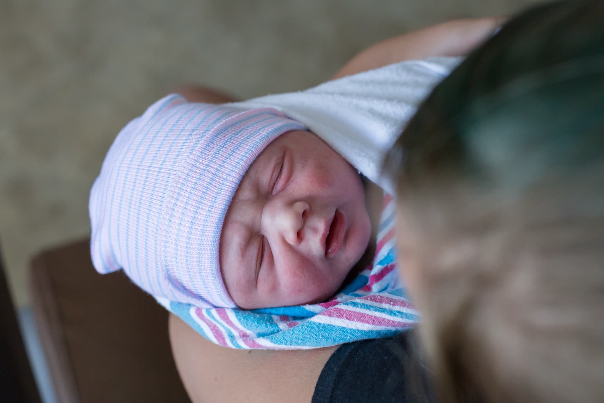 sister holding newborn baby pittsburgh birth at hospita
