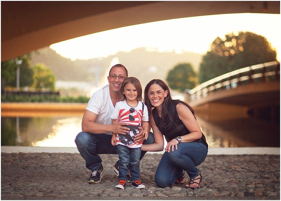 family photo session at sunset at point state park under the tunnel with fountain