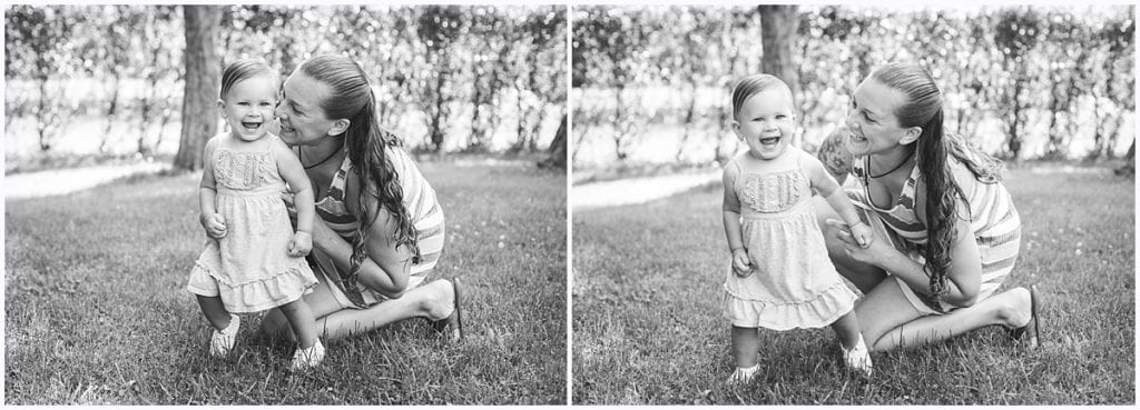 little girl with mom smiling at camera outside Pittsburgh toddler photographer