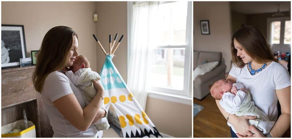 mom holding newborn by teepee by window pittsburgh newborn session
