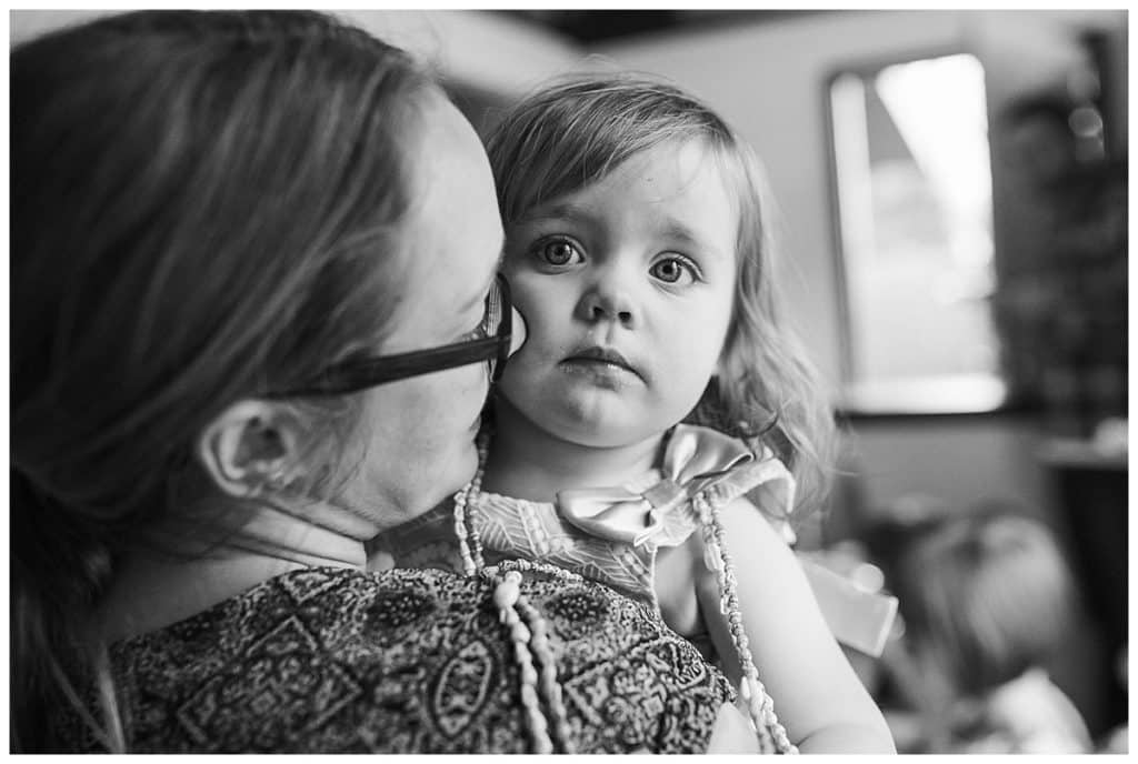 black and white photo of toddler girl with mom