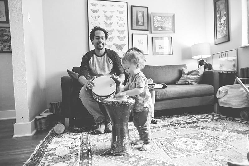 father and son playing drums together at home for a pittsburgh lifestyle photo session