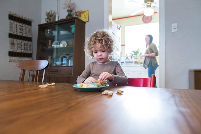 little girl at table for a photo session at his home in pittsburgh