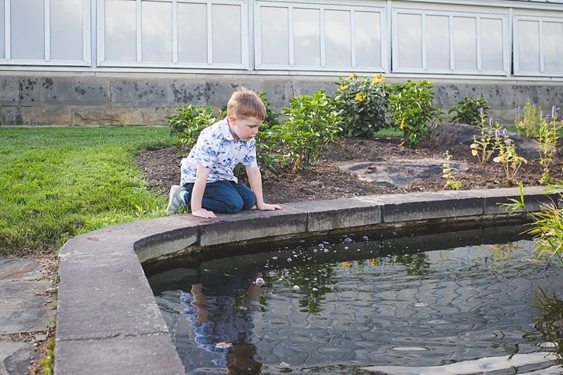 boy at pittsburgh phipps by fountain for family photo session