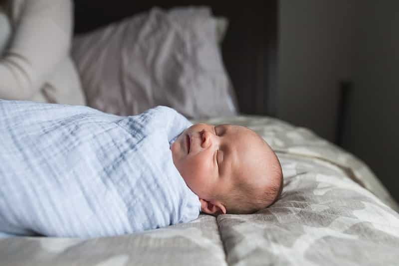 newborn on bed in pittsburgh home for lifestyle session