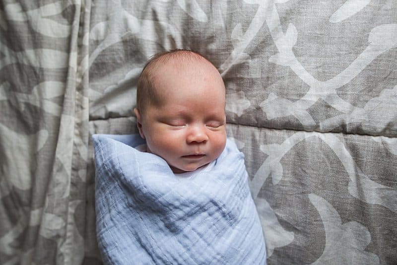 newborn on bed in pittsburgh home for lifestyle session
