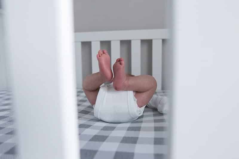newborn in crib in pittsburgh home for lifestyle session