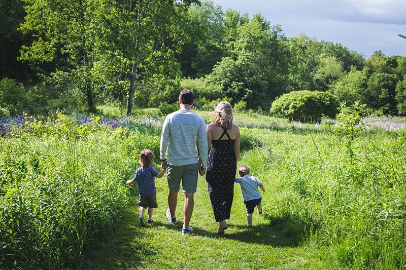 family holding hands walking lifestyle photo session at beechwood farms in pittsburgh 