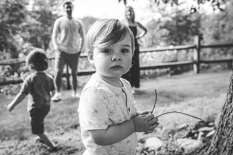 little boy playing at beechwood farms in pittsburgh for family photos