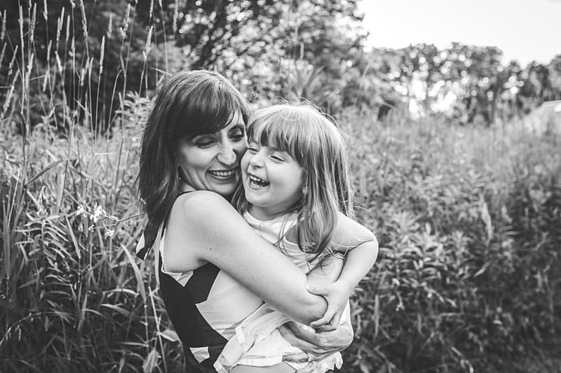 mother and daughter in flower field for lifestyle family photo session with Mary Beth Miller photography