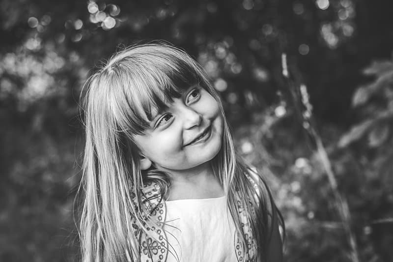 laughing and smiling girl in black and white