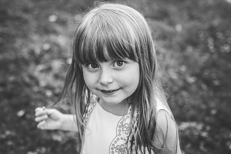 bright eyes of little girl in black and white