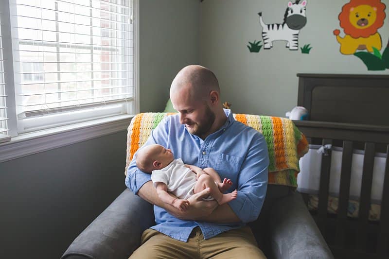 pittsburgh dad in nursery with newborn lifestyle photo session 