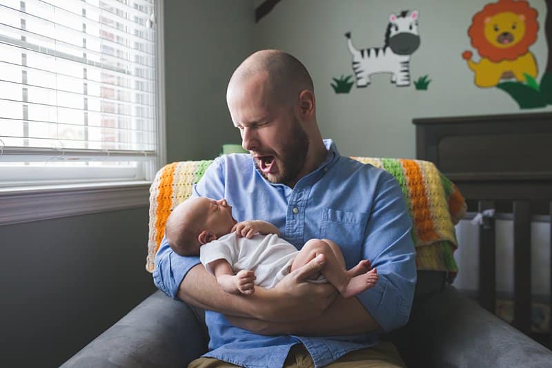 pittsburgh dad in nursery with newborn lifestyle photo session 