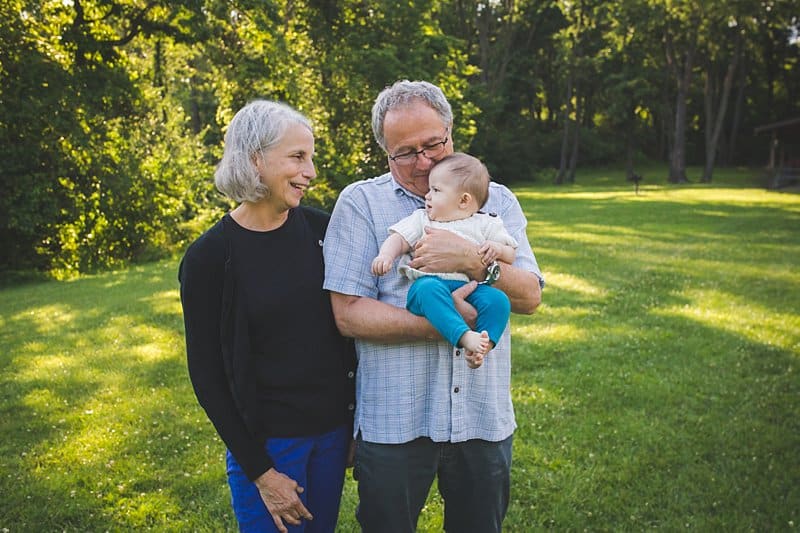 grandparents holding baby girl at pittsburgh park