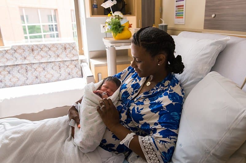 mom at magee hospital holding newborn baby