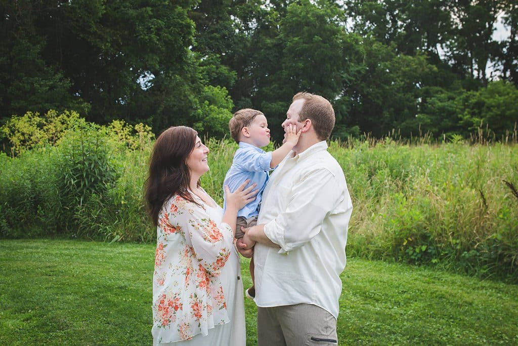mom dad and son boyce mayview park family photo session in field