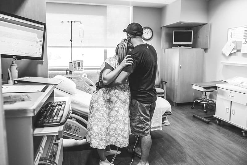 husband supports wife during labor in magee hospital