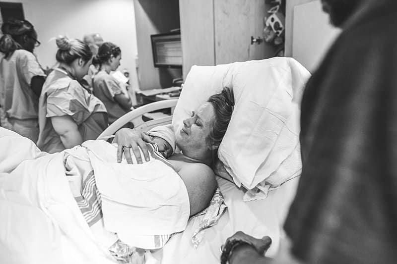 mother embracing newborn after natural birth to baby at magee womens hospital
