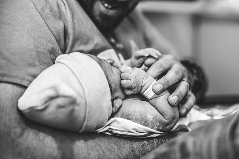 dad holding newborn baby at magee womens hospital pittsburgh