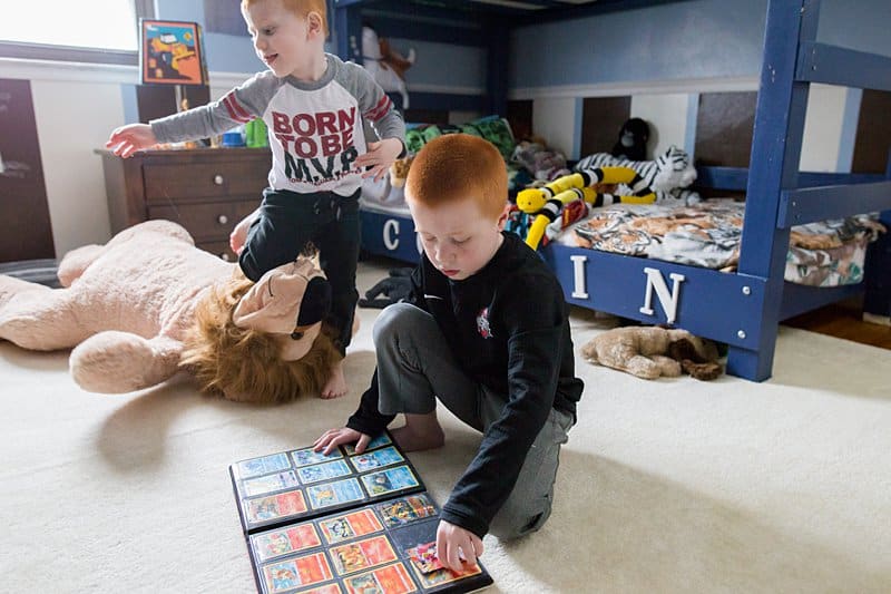 little boy with his pokemon cards