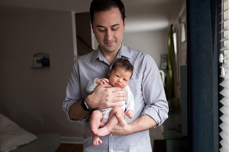 pittsburgh dad holding newborn son for photos Sewickley newborn photographer