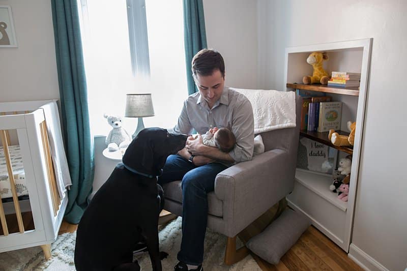 dad dog newborn son in pittsburgh nursery for photo session 