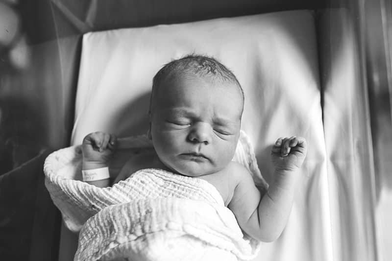 newborn in crib for fresh 48 hospital session in pittsburgh