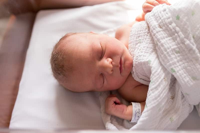 newborn in crib for fresh 48 hospital session in pittsburgh