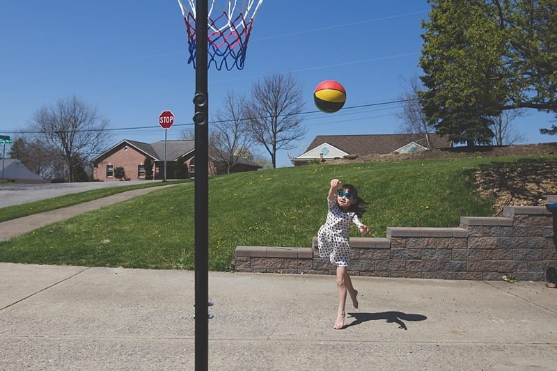 girl playing basketball in pittsburgh driveway