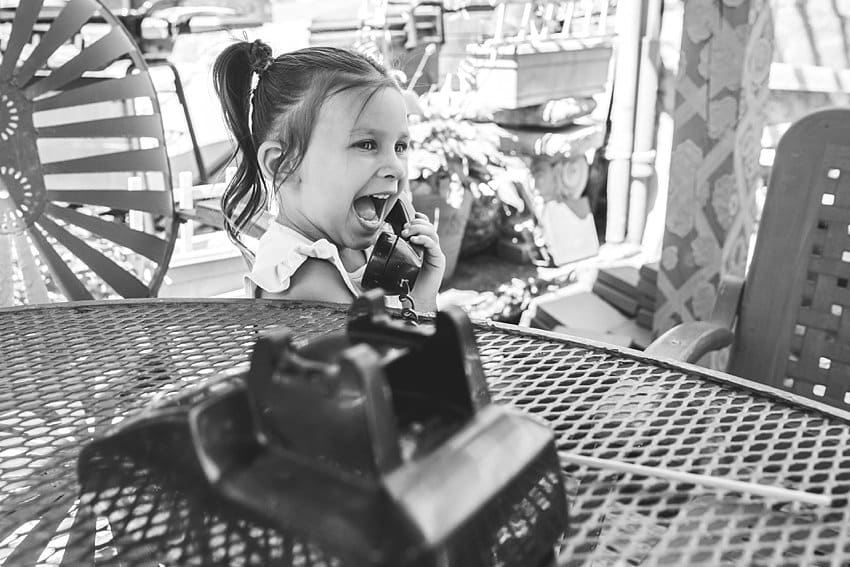 little girl on rotary phone at randyland pittsburgh randyland photo session
