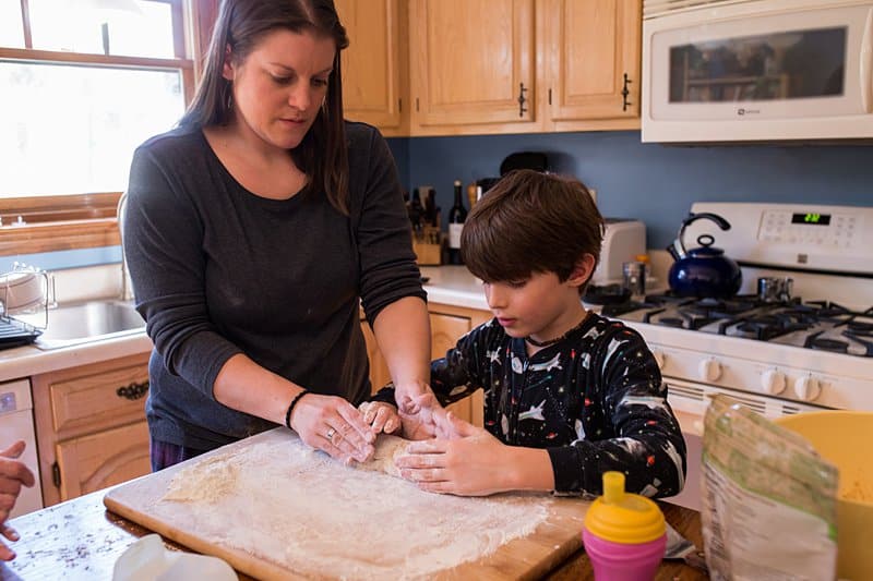 mother and son kneading dough mom doing dishes allison park kitchen