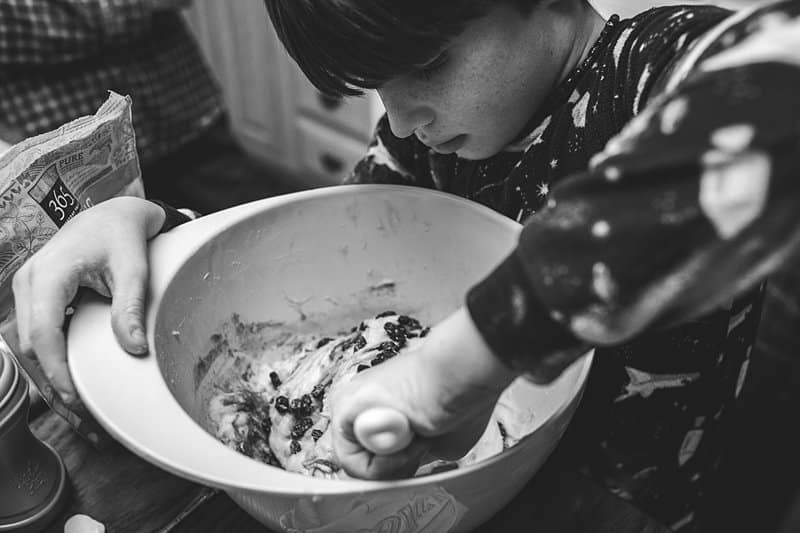 boy mixing dough in bowl