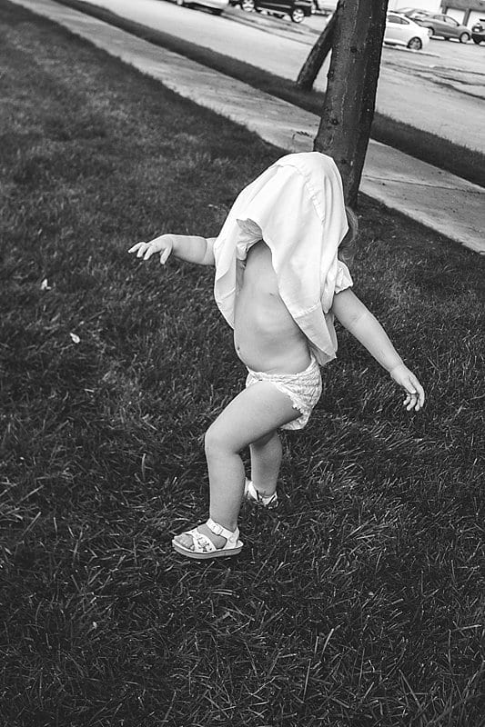 little girl with dress over head