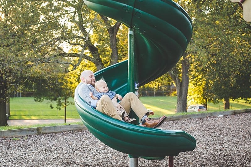 dad and son on slide at carnergie playground pittsburgh