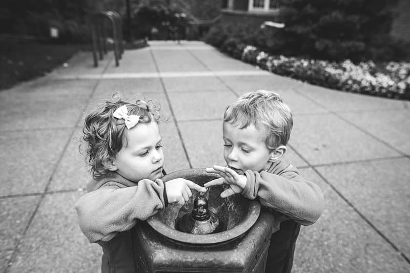 twin siblings at water fountain schenley visitor center