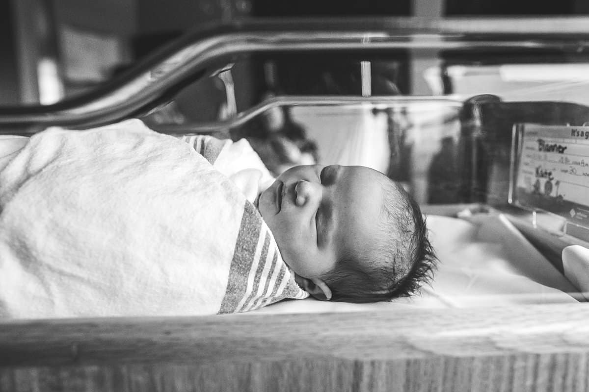 newborn baby in pittsburgh hospital bassinet