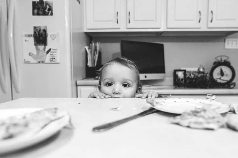 little boy peeking over counter