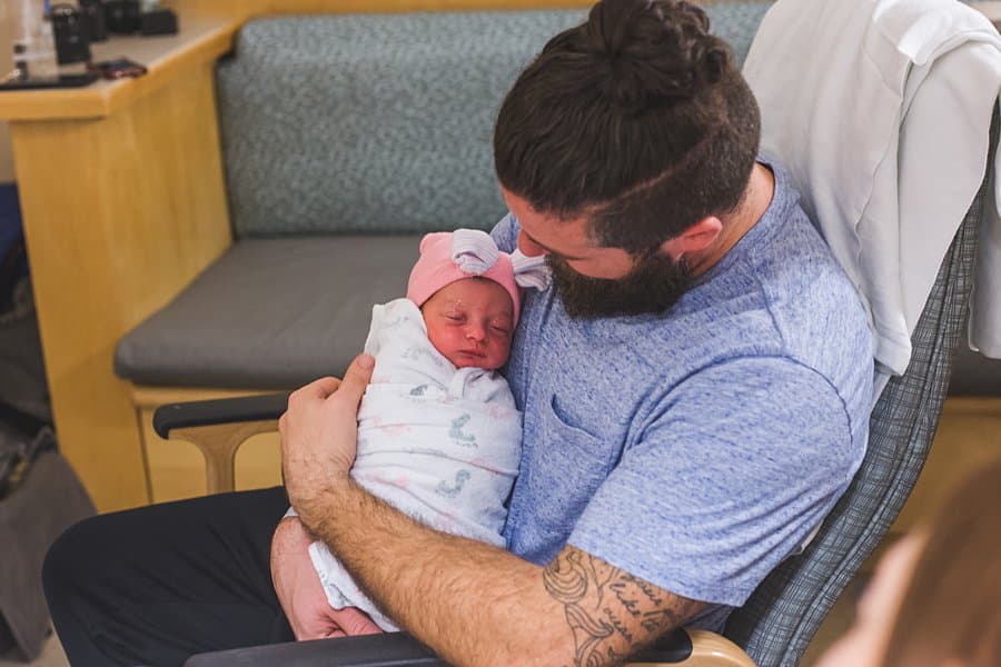 father and newborn baby at magee hospital in pittsburgh after birth of baby girl