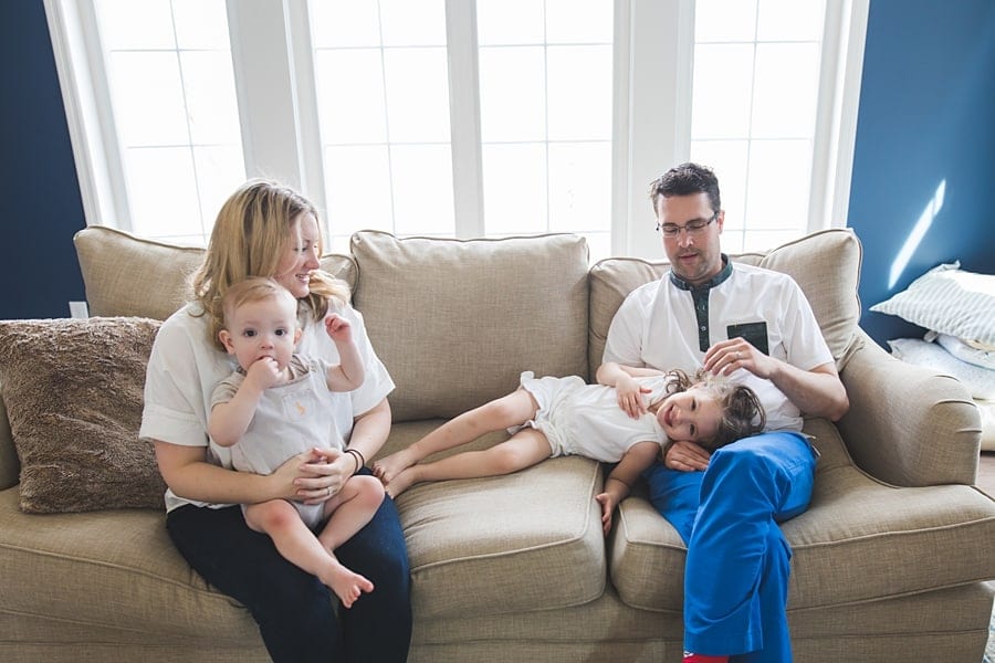 family on couch in bridgeville home for family photo session