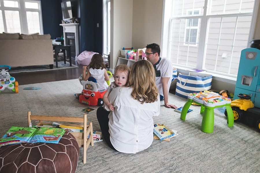 bridgeville family playing in home for lifestyle family photo session