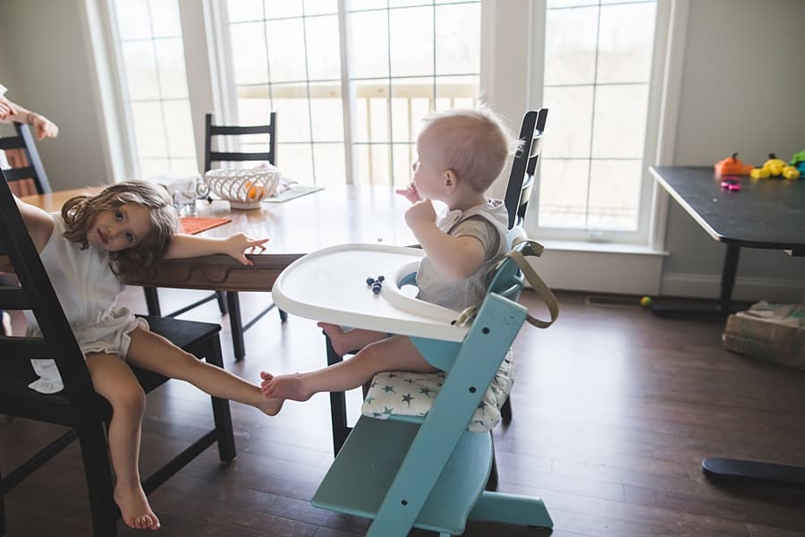toddler eating in highchair in pittsburgh home mary beth miller