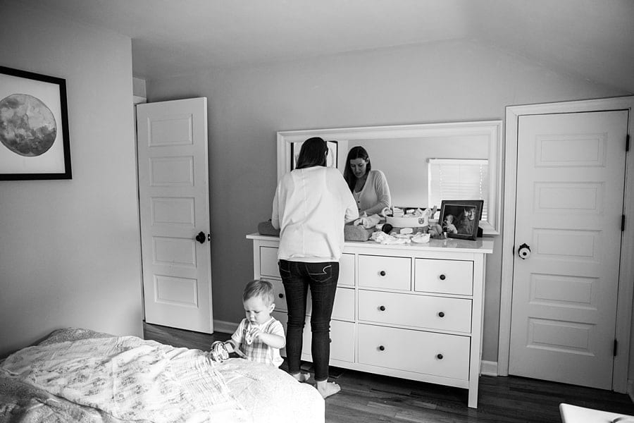 baby on changing table in pittsburgh nursery for photo newborn photo session