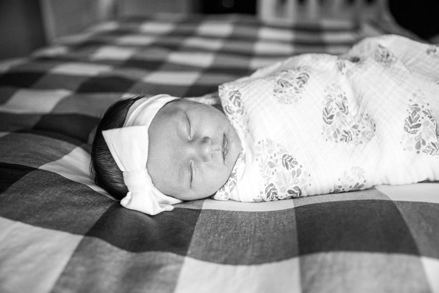 baby on bed in pittsburgh home for photo newborn photo session