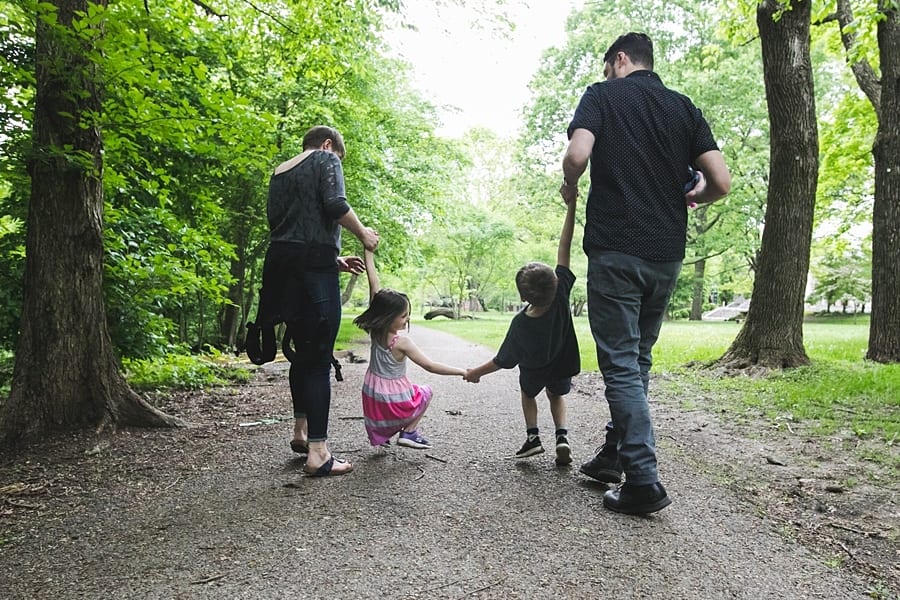 family walking through frick park pittsburgh