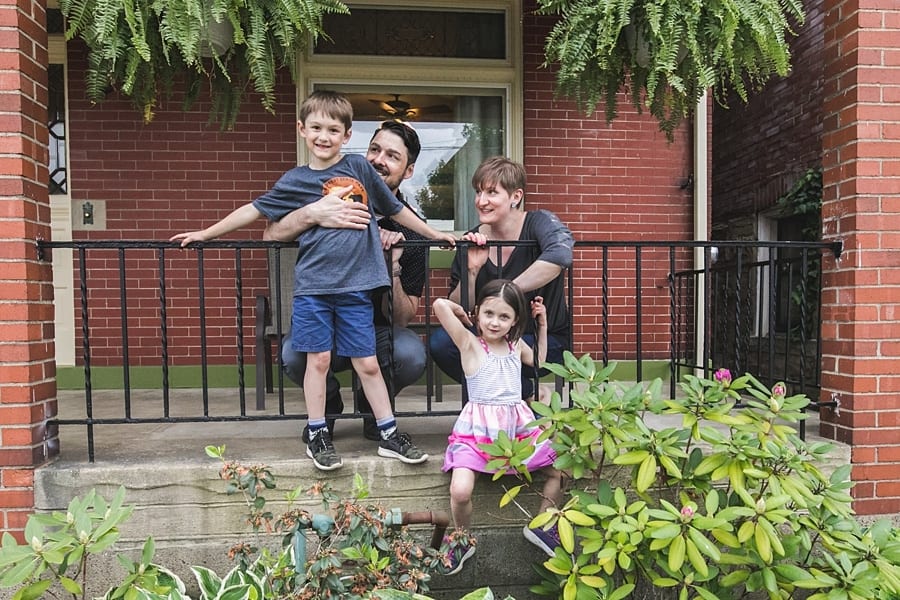 family on the porch of their pittsburgh home