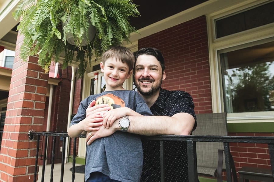 father and son on porch of point breeze home