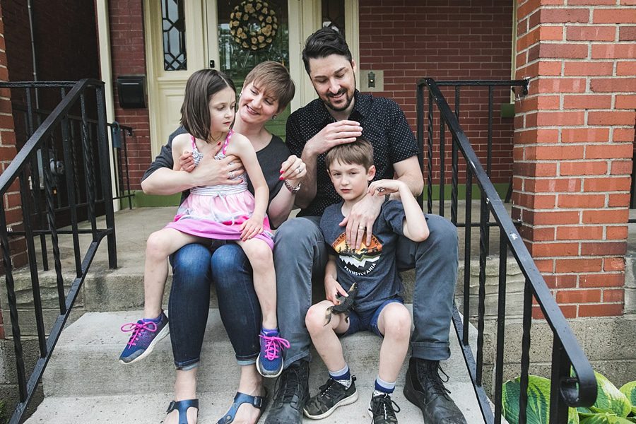 family on porch of point breeze home