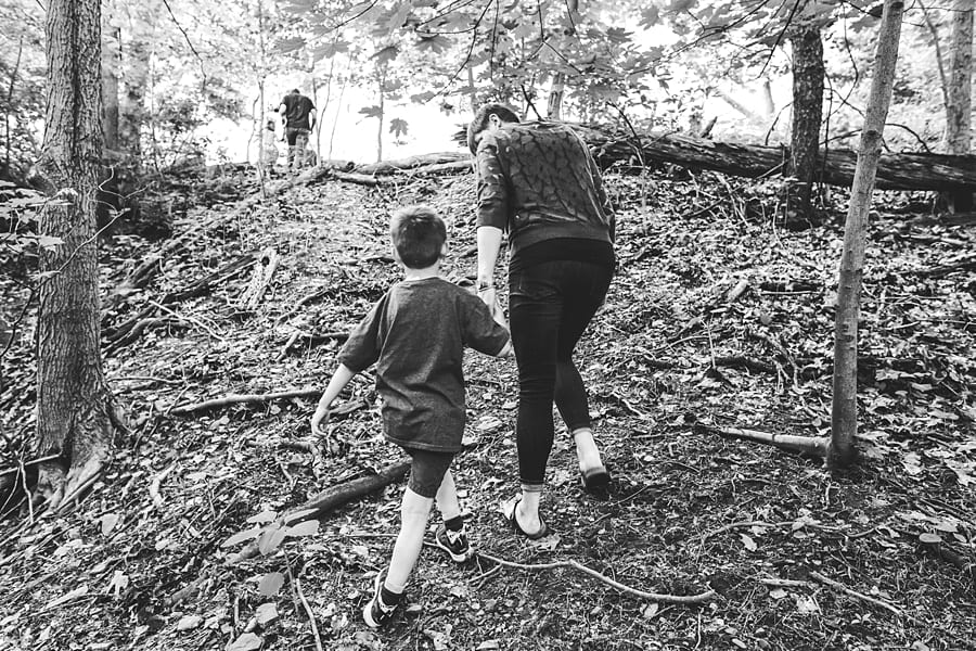 mother and son walking through frick park pittsburgh