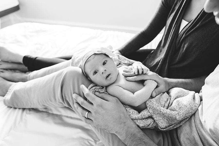 awake newborn baby on bed of pittsburgh home